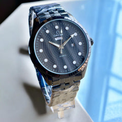 Ome°ga Date-Day Metal Watch