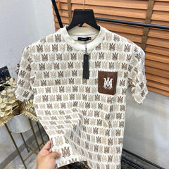 AMI.RI  MONOGRAM PRINTED LEATHER POCKET IMPORTED DROP SHOULDER T-SHIRT