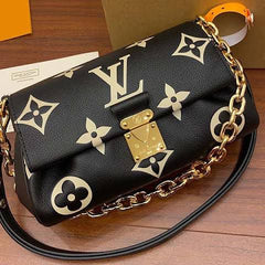 LO.UIS VUIT.TON EMPREINTE LEATHER HANDBAG CUM SLING