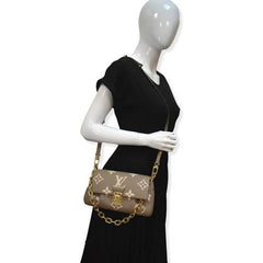 LO.UIS VUIT.TON EMPREINTE LEATHER HANDBAG CUM SLING