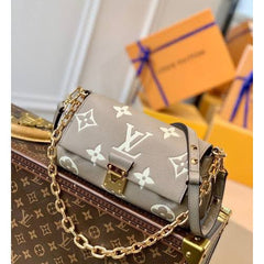 LO.UIS VUIT.TON EMPREINTE LEATHER HANDBAG CUM SLING