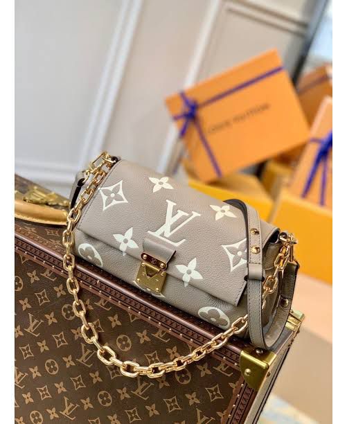 LO.UIS VUIT.TON EMPREINTE LEATHER HANDBAG CUM SLING