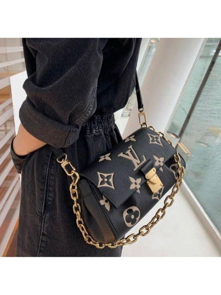 LO.UIS VUIT.TON EMPREINTE LEATHER HANDBAG CUM SLING