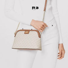 MICH.AEL KO.RS LARGE  DOME CROSS BODY SLING