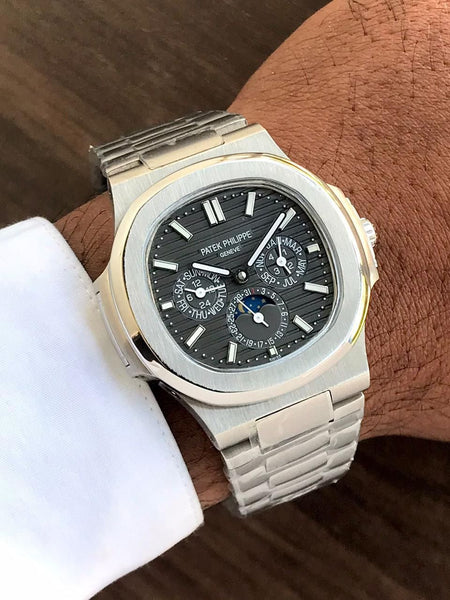 Pate.k Phil.ippe Nautilus GMT day month automatic