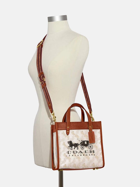 Coa.ch fi.eld horse and carriage tote bag