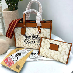 Coa.ch fi.eld horse and carriage tote bag