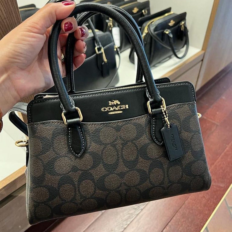 COA.CH DAR.CIE SIGNATURE CANVAS LEATHER HANDBAG CUM SLING