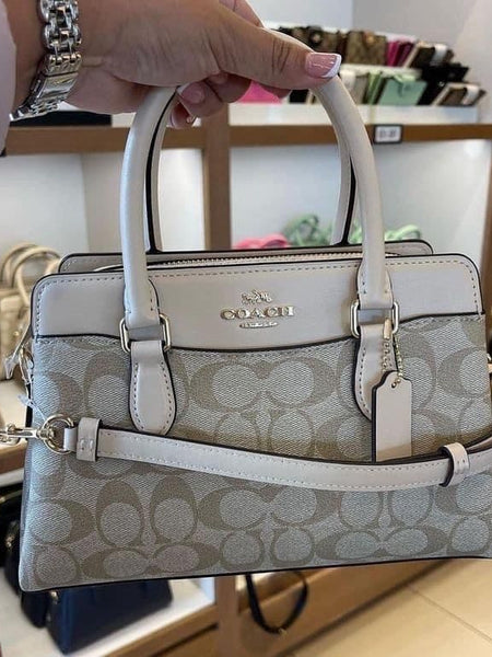 COA.CH DAR.CIE SIGNATURE CANVAS LEATHER HANDBAG CUM SLING
