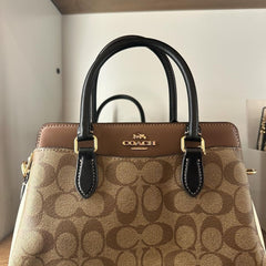 COA.CH DAR.CIE SIGNATURE CANVAS LEATHER HANDBAG CUM SLING