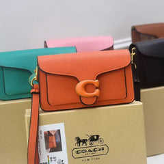 CO.ACH TABBY WRISTLET CUM SHOULDER BAG