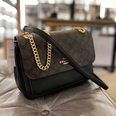 Co.ach klare sling bag