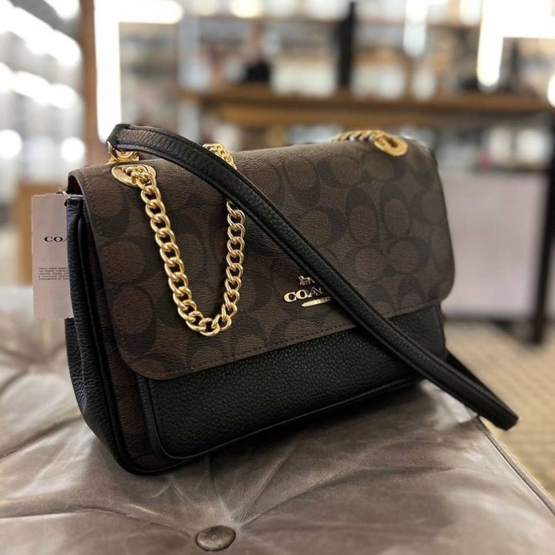 Co.ach klare sling bag
