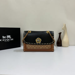 Coa.ch Parker with rivets sling