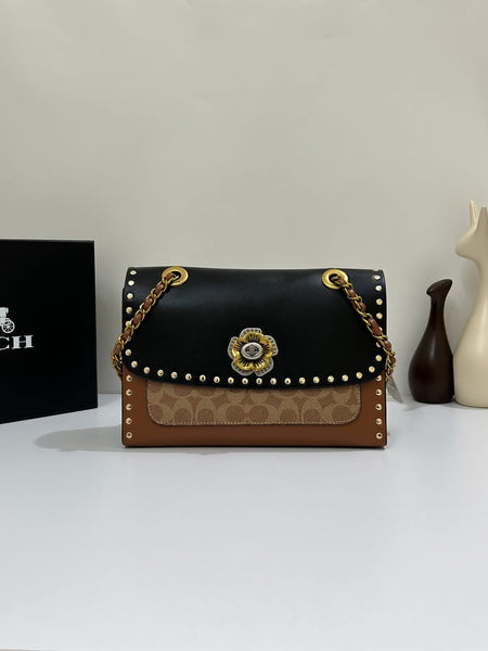Coa.ch Parker with rivets sling