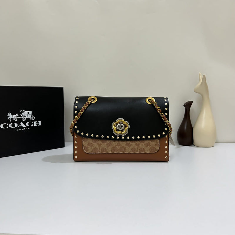 Coa.ch Parker with rivets sling